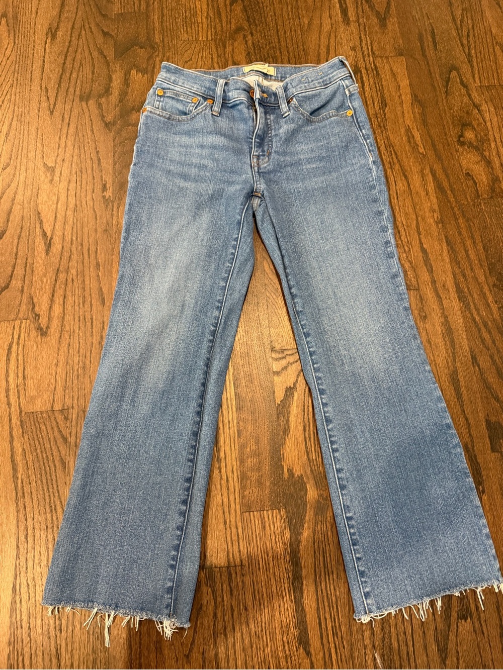 Madewell light blue flare jeans with frayed hem